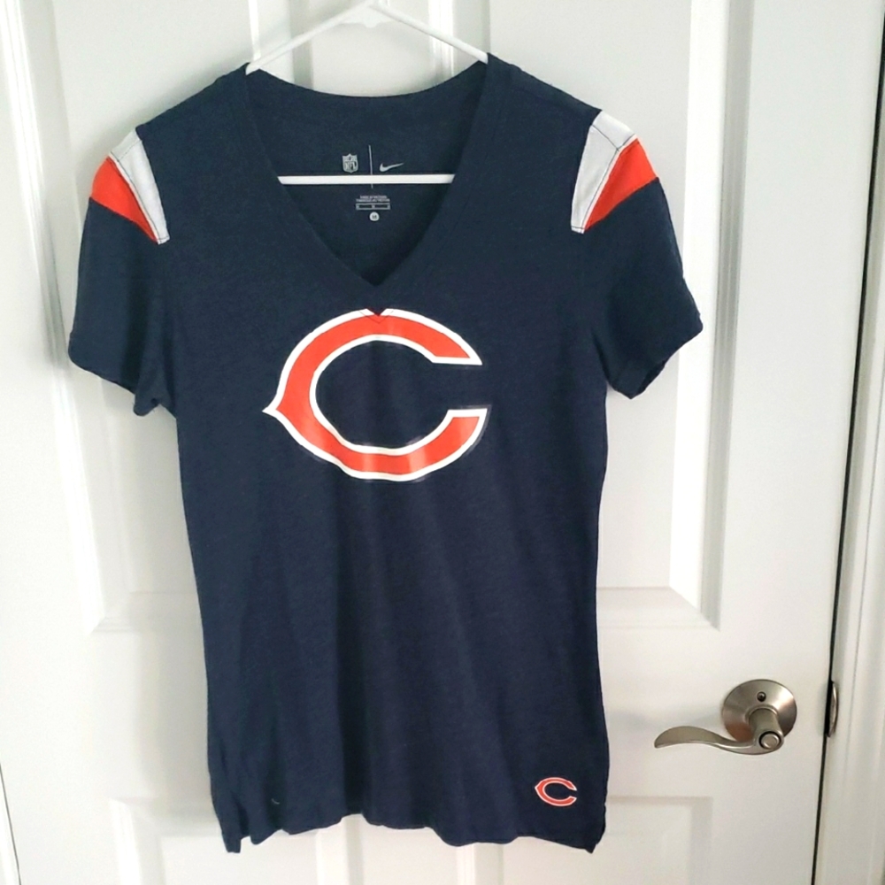 Nike Dark Blue T-Shirt with Orange and White Accents.
